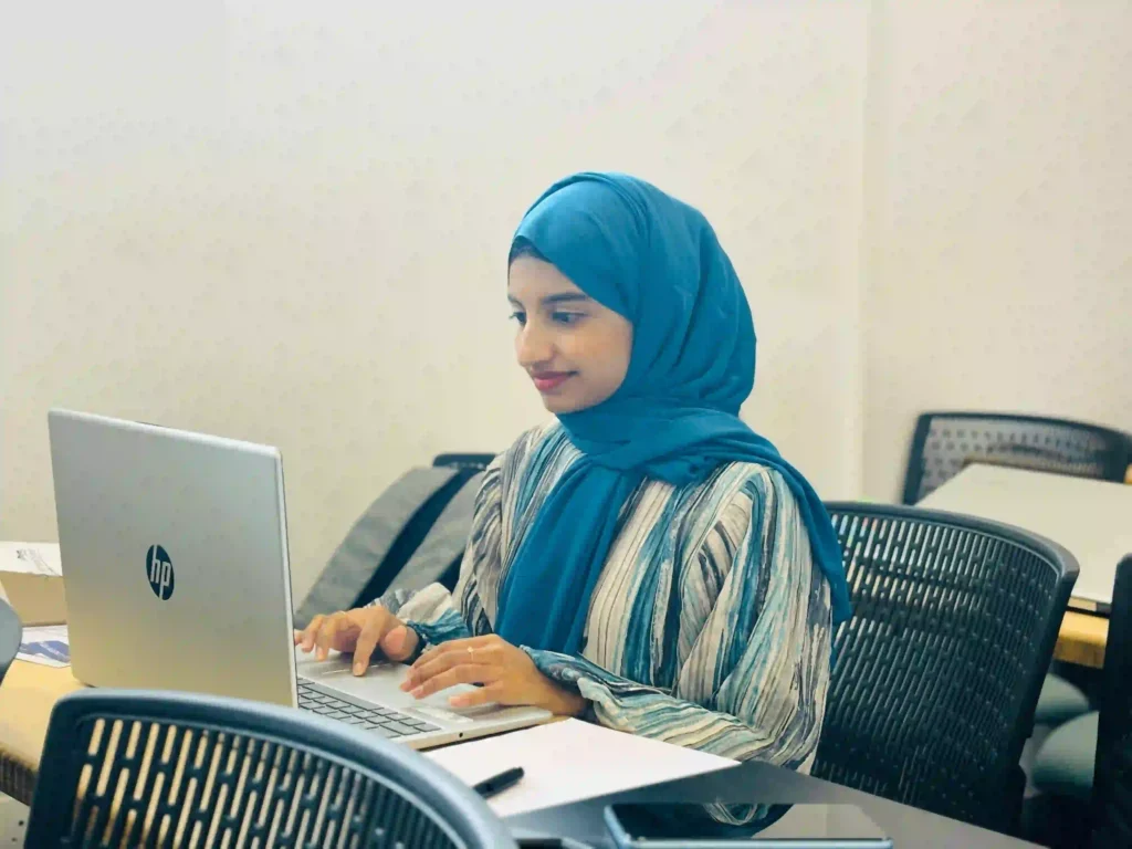 freelance digital marketing strategist in malapuram sitting infront of a laptop